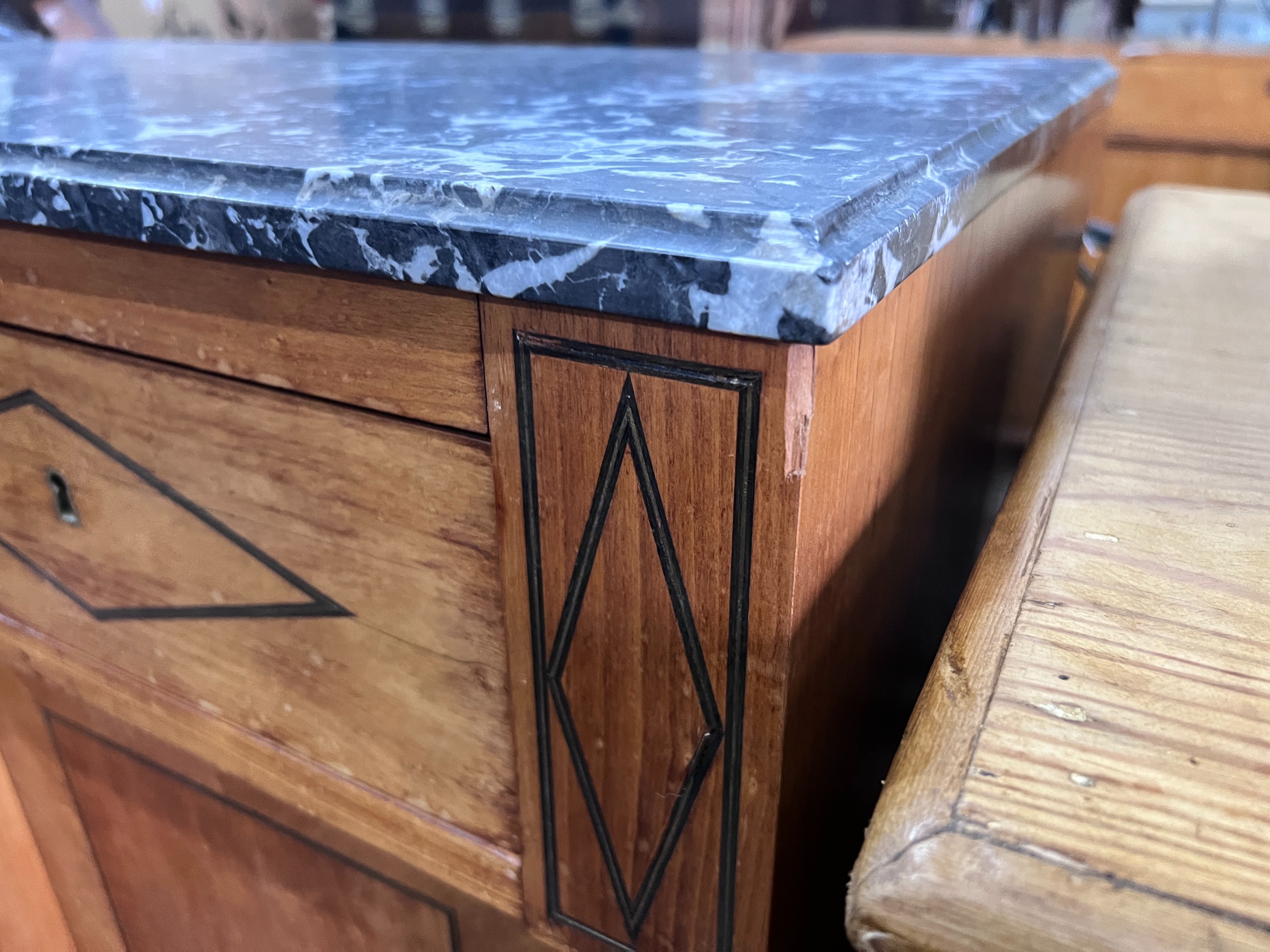 A continental marble topped fruitwood breakfront bookcase, with variegated grey marble top, four drawers and four doors, width 207cm, height 103cm *Please note the sale commences at 9am.